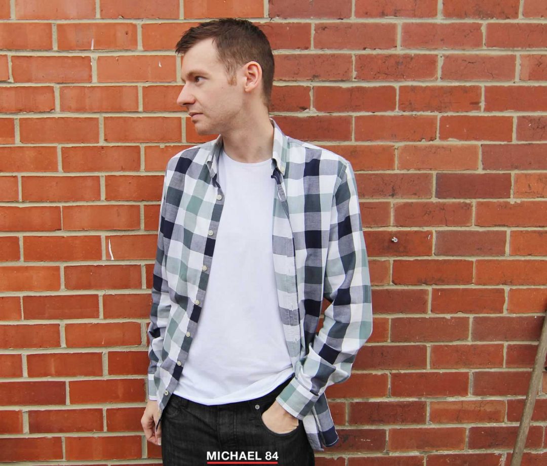 Layering a check shirt with a white t shirt in autumn