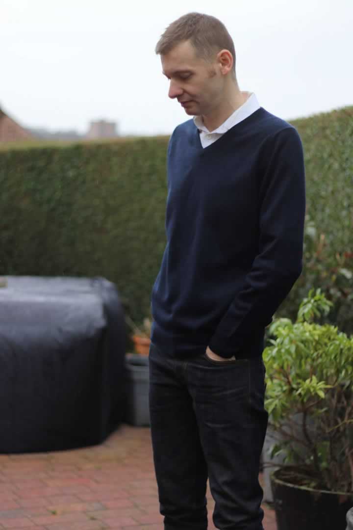 Wearing a sweater as part of a smart casual outfit